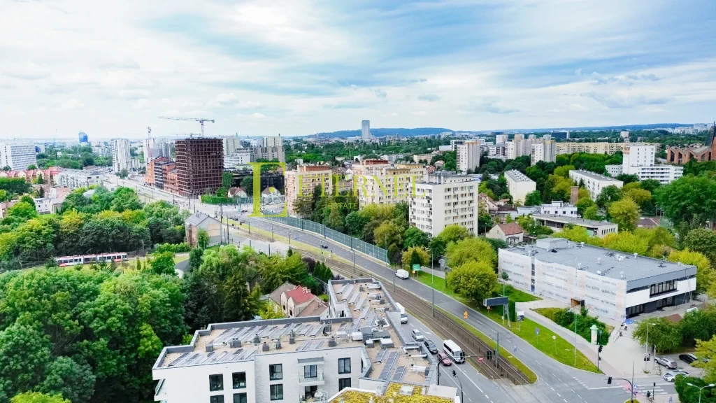 Działka inwestycyjna 5,1 ara z budynkiem – Aleja Jana Pawła II
