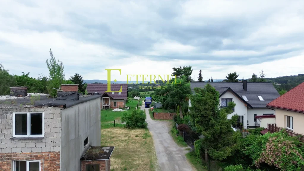 Działka mieszkaniowo-usługowa 15 arów przy DK94 na sprzedaż – Modlnica, gmina Wielka Wieś