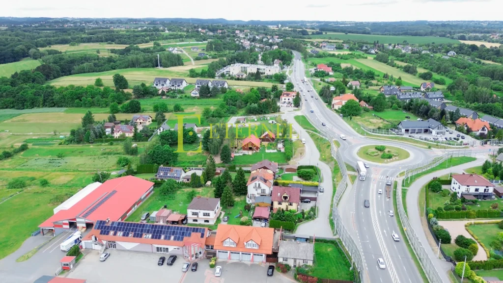 Działka mieszkaniowo-usługowa 15 arów przy DK94 na sprzedaż – Modlnica, gmina Wielka Wieś