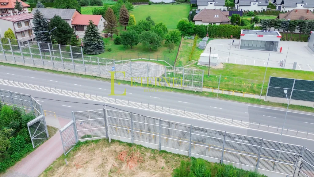 Działka mieszkaniowo-usługowa 15 arów przy DK94 na sprzedaż – Modlnica, gmina Wielka Wieś