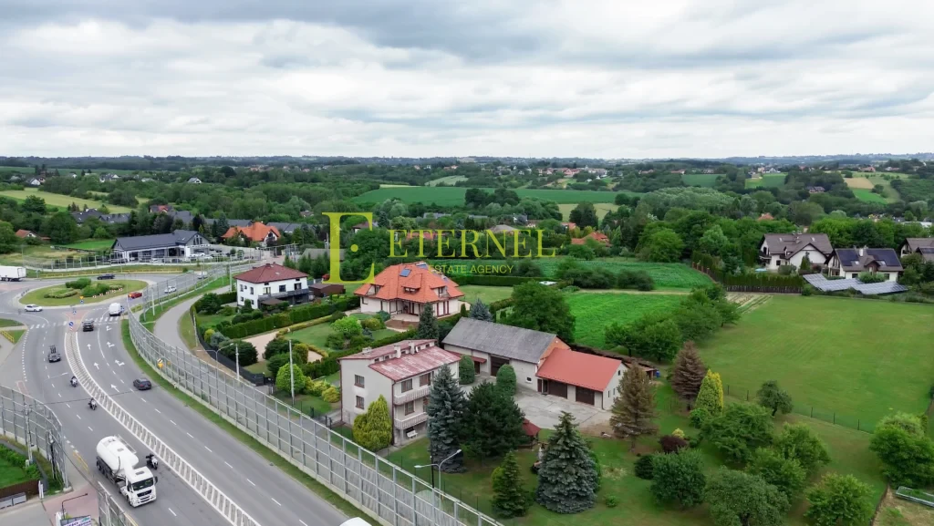 Działka mieszkaniowo-usługowa 15 arów przy DK94 na sprzedaż – Modlnica, gmina Wielka Wieś